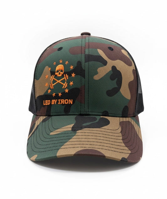 Camouflage baseball cap with skull and crossbones design and 'Led by Iron' text on a white background